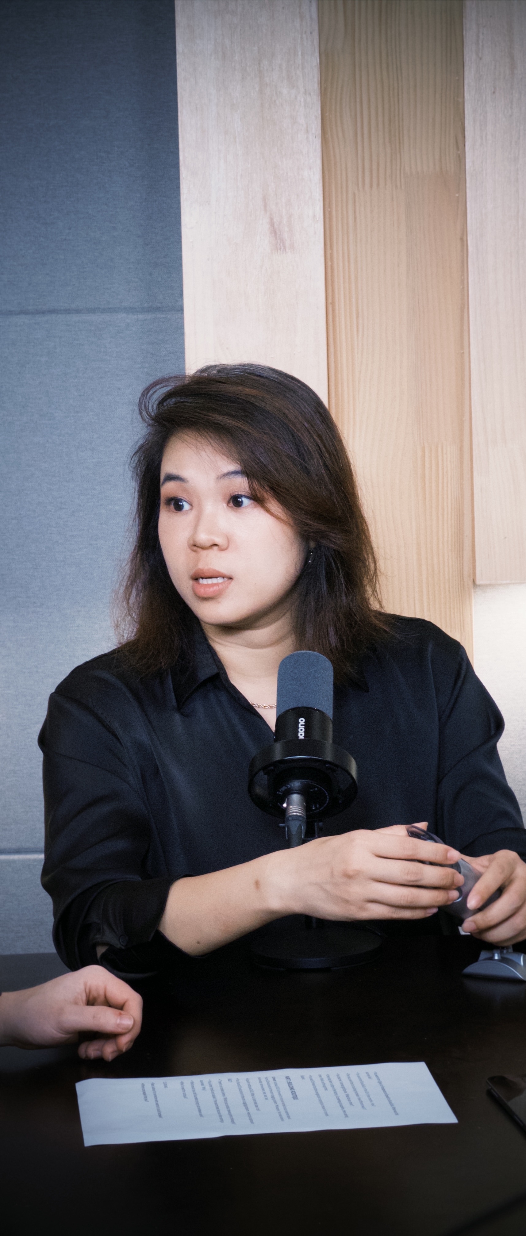 Denise Wu at the podcast studio